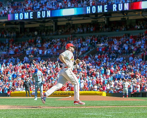 Paul Goldschmidt of the Cardinals rounds the bases after hitting a solo home run during the eighth inning of Saturday afternoon's game against the Mets at Busch Stadium.