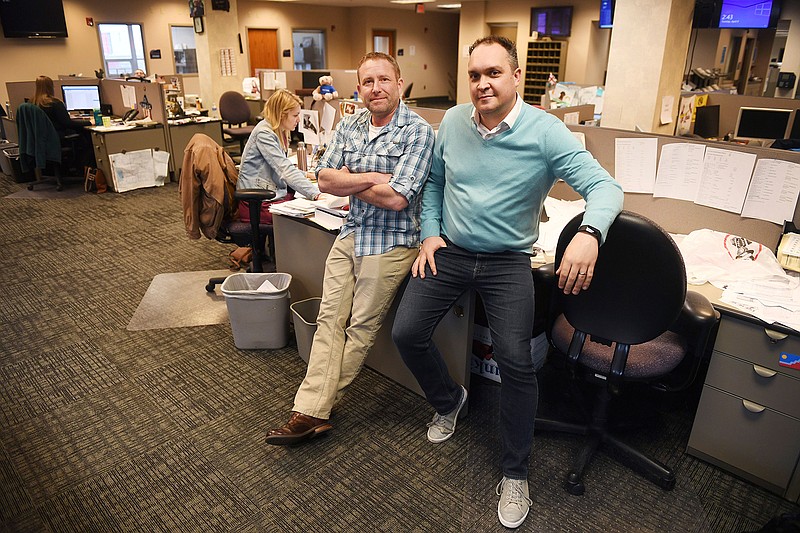 In this April 9, 2019, photo, Argus Leader investigative reporter Jonathan Ellis and news director Cory Myers in the newsroom in Sioux Falls, S.D. In 2010, reporters at South Dakota's Argus Leader newspaper came up with the idea of requesting data about the government's food assistance program. They thought the information about the $65-billion dollar-a year program, previously known as food stamps, could lead to a series of stories and help them identify possible fraud. But the government didn't provide everything the paper wanted. Trying to get the data has taken the paper more than eight years and landed the case at the Supreme Court. (Briana Sanchez/The Argus Leader via AP)