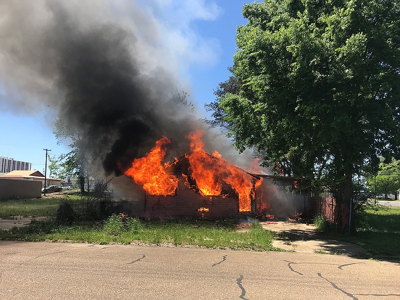 The Texarkana, Ark., Fire Department is investigating a blaze that gutted a wood-frame home early Saturday afternoon in the 700 block of Ash Street. The house, believed to have been vacant for years, was engulfed when Arkansas-side firefighters, with Texarkana, Texas, firefighters on standby, arrived shortly before 1 p.m. They had the fire under control in about 30 minutes, Arkansas-side Incident Commander Ginger Lee said. At presstime, officials weren't sure how the fire started or where it originated. Lee said all of the home's utilities had been discontinued for years, ruling out the possibility of an electrical origin. No one was found in the home, and no one was injured. (Photo courtesy of Tom Morrissey)