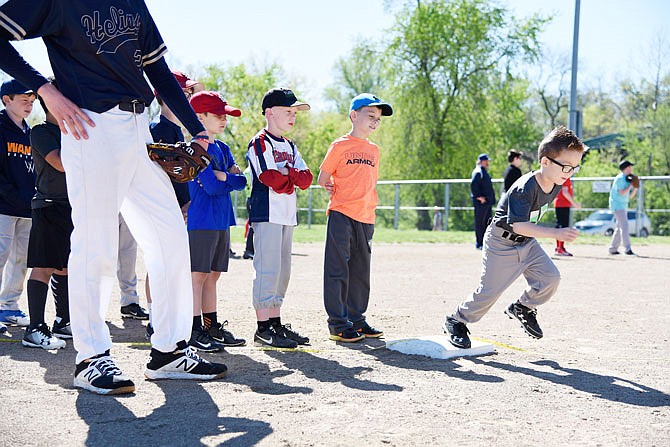 Participants of the Major League Baseball run competition line up Saturday at Vivion field. The competition includes an MLB pitch, hit and run competition, as well as an MLB Jr. Home Run Derby.