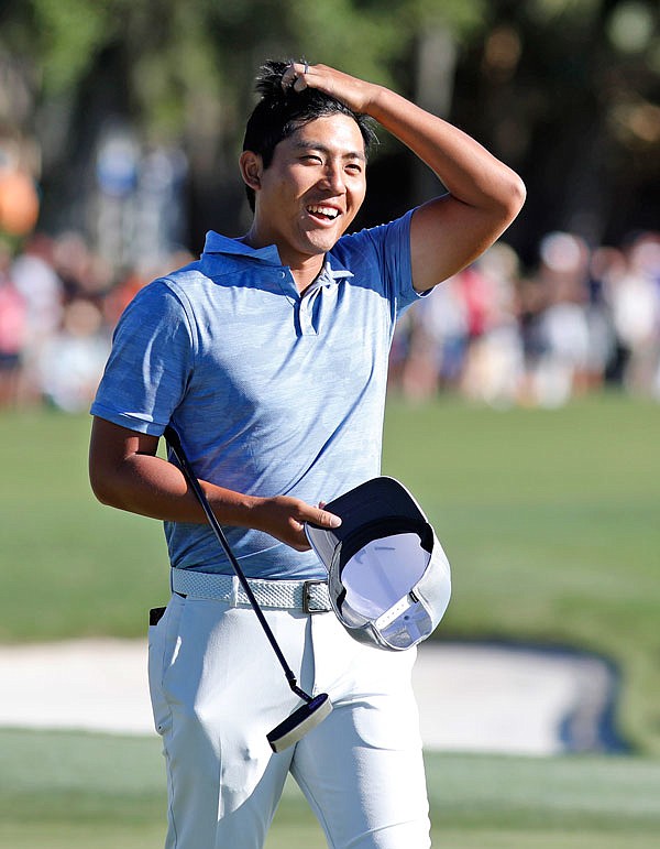 C.T. Pan smiles as he walks off the green on the 18th hole during Sunday's final round of the RBC Heritage at Harbour Town Golf Links on Hilton Head Island, S.C.