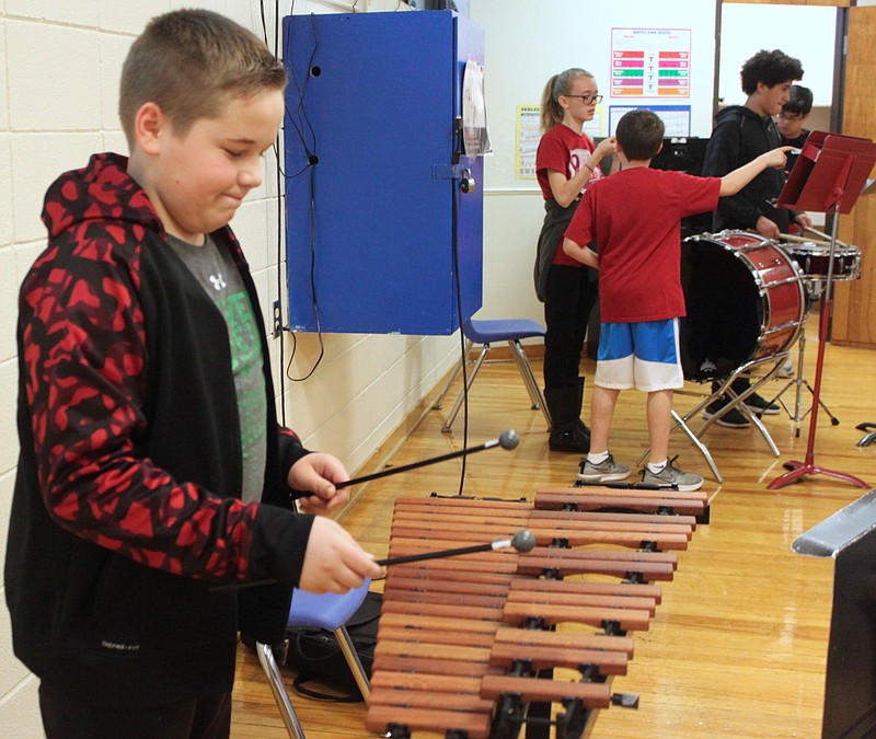 California seventh-grader Cody Bolfing warms up on the new xylophone purchased with funds from the EM Burger Foundation.