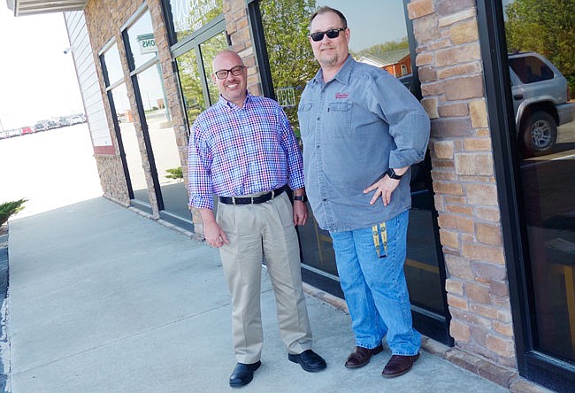 Greg Newsom, manager of United Credit Union's Fulton branch, and CEO/president Brent Sadler, announced a new branch will be constructed this summer.
