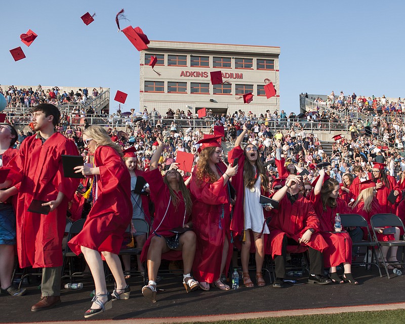 Stephanie Sidoti/News TribuneMembers of the Jefferson City High School Class of 2018 cheer and throw their mortarboard caps into the air in celebration at the conclusion of the commencement exercise held at Adkins Football Stadium on Sunday, May 13, 2018.