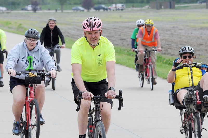 Deputy State Parks Director Mike Sutherland, center, and other attendees of the 2019 Missouri Legislators Bike Ride, ride their bikes Tuesday near the Missouri state Capitol and head to the North Jefferson Katy Trail. The ride is a partnership with Missouri State Parks, MODOT and Missouri Bicycle and Pedestrian Federation and covered a total of 6 miles.