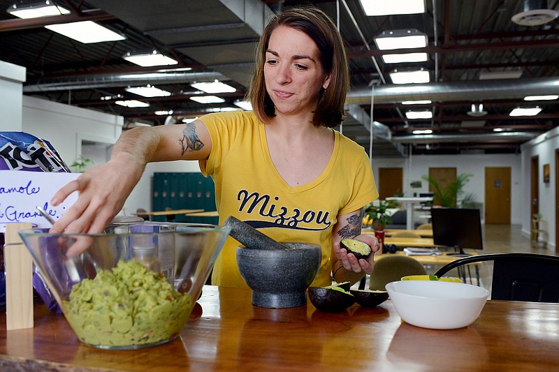Sally Ince/ News Tribune
Community manager Tina Casagrand mixes her bowl of guacamole Friday April 19, 2019 during a Holy Guacamole preliminary round at Campus Working Space. The prelim included 3 Campus associates who competed for the best dish. The winner of the prelim will go on to compete in the first ever Inaugural Holy Guacamole Competition taking place May 3 in Old Munichberg.