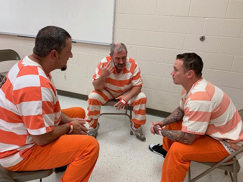 Inmates Scottie Flournoy and Jeffey James talk to inmate Matthew Van Horn about the Sevier County Sheriff's Office Residential Substance Abuse Treatment program. Flournoy and James are graduating from the program Thursday and Van Horn will be starting the program later in the month.