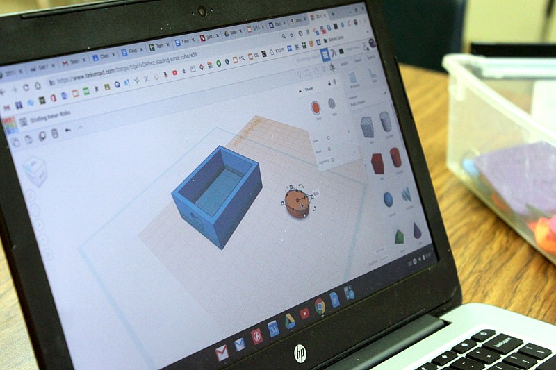 Students at California Middle School are learning a new-to-them program called Tinkercard that enables them to create 3D printed teacher appreciation gifts, signs and other objects. But it all starts with the computer where students move a digital version of their desired object just before printing the final product.