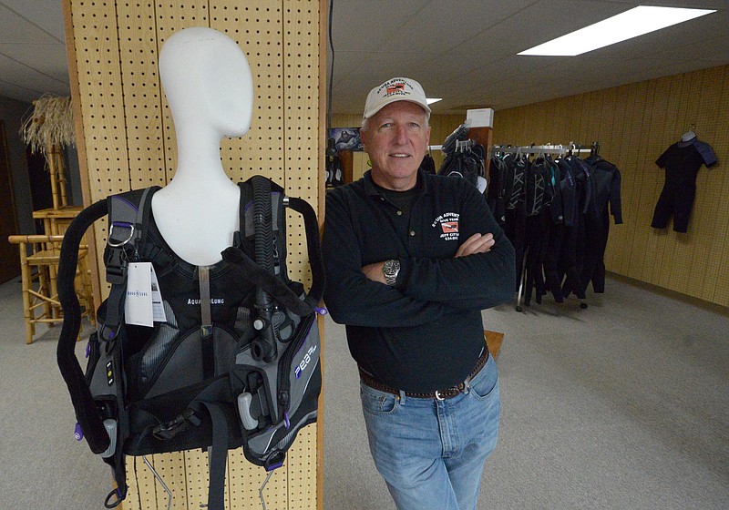 Mark Wilson/News Tribune
Jeff Roberts in the retail showroom of Scuba Adventure Friday. The business has opened in a new location after a fire destroyed its previous location on Jefferson Street in April.
