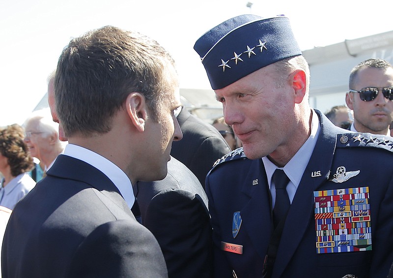 FILE - In this June 19, 2017 file photo, French President Emmanuel Macron, meets with Gen. Tod Wolters, while visiting the Paris Air Show in Le Bourget, north of Paris. At ceremonies Thursday in Germany and Friday in Belgium, Air Force Gen. Tod Wolters will take over for Army Gen. Curtis Scaparrotti as head of U.S. European Command and as NATO’s Supreme Allied Commander Europe. Scaparrotti is retiring. (AP Photo/Michel Euler, Pool)
