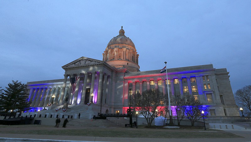 FILE - In this Monday, Jan. 9, 2017, file photo, lights shine on the Missouri Capitol as guests arrive for an inaugural ball in Jefferson City, Mo. (AP Photo/Orlin Wagner, File)