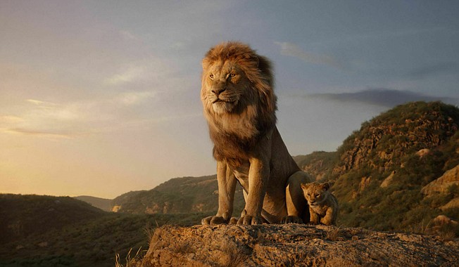 This image released by Disney shows the characters Mufasa, voiced by James Earl Jones, left, and Simba, voiced by JD McCrary, in a scene from "The Lion King," directed by Jon Favreau. (Disney via AP)