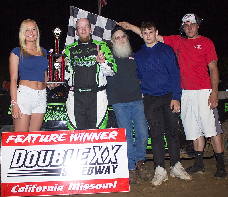Kyle Smith and crew member claim the hobby stock feature trophy at Double-X Speedway, May 4, 2019. (Photo courtesy of Carol Wirts)