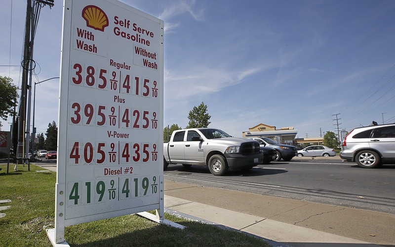 FILE - In this April 23, 2019, file photo gas prices are displayed at a Shell station in Sacramento, Calif. Gasoline for that summer road trip will cost a bit more than experts in the federal government were expecting just a month ago. The government is also predicting higher crude prices, as higher U.S. production is offset by declines elsewhere. (AP Photo/Rich Pedroncelli, File)