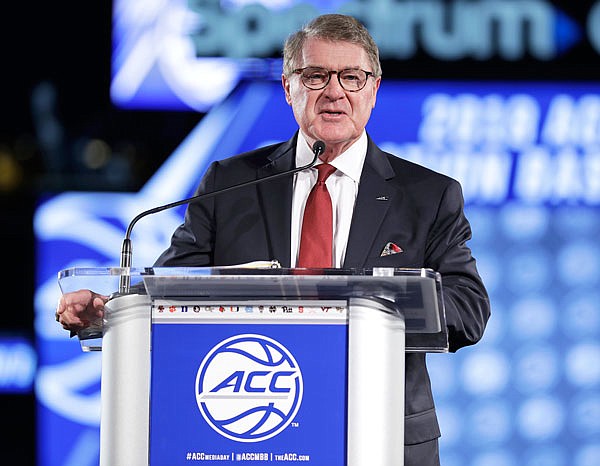 In this Oct. 24, 2018, file photo, commissioner John Swofford speaks to the media during a news conference at the Atlantic Coast Conference college basketball media day in Charlotte, N.C. Speaking Monday at a regional Associated Press Sports Editors meeting in Greensboro, N.C., Swofford said "everything is on schedule" for the August launch of the league's TV channel.