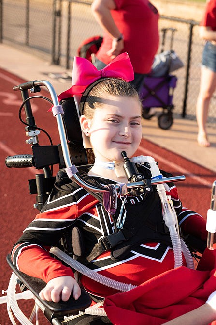 Margaret Romph is seen in her cheerleading uniform during a Jefferson City High School homecoming game.