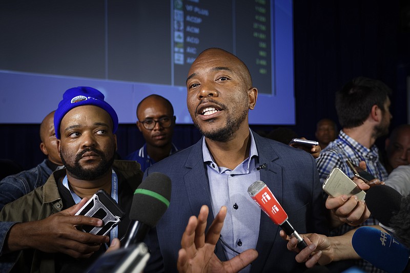 Mmusi Maimane, leader of the largest opposition party, the Democratic Alliance, speaks to the media as he visits the Independent Electoral Commission Results Center in Pretoria, South Africa Thursday, May 9, 2019. South Africans voted Wednesday in a national election and preliminary results show that the ruling African National Congress party (ANC) has an early lead in the national elections but has seen its share of the vote drop significantly. (AP Photo/Ben Curtis)