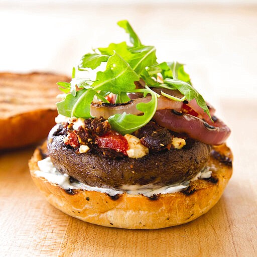 This undated photo provided by America's Test Kitchen in April 2019 shows a Grilled Portobello Burger in Brookline, Mass. This recipe appears in the cookbook “Vegetables Illustrated.” (Joe Keller/America's Test Kitchen via AP)