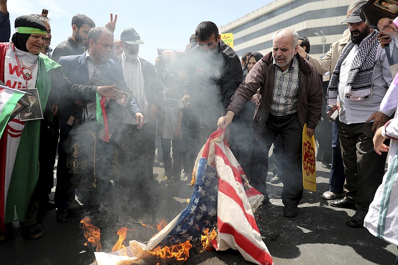 Iranian worshippers burn a representation of a U.S. flag during a rally after Friday prayer in Tehran, Iran, Friday, May 10, 2019. A top commander in Iran's powerful Revolutionary Guard said Friday that Tehran will not talk with the United States, an Iranian news agency reported — a day after President Donald Trump said he'd like Iranian leaders to "call me." (AP Photo/Ebrahim Noroozi)