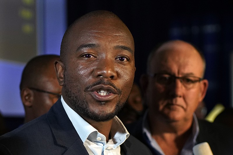 Mmusi Maimane, leader of the largest opposition party, the Democratic Alliance, speaks to the media as he visits the Independent Electoral Commission Results Center in Pretoria, South Africa Friday, May 10, 2019. The ruling African National Congress held a comfortable lead in South Africa's presidential and parliamentary election with more than two-thirds of the vote counted Thursday, but the incomplete count showed the party received less support than in the last balloting five years ago. (AP Photo/Jerome Delay)