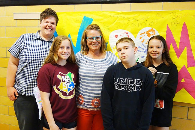 Fulton Middle School teacher Trish Alexander, center, is Fulton Public Schools' Teacher of the Year. She's pictured here with current and former students including, from left, Assistant Principal Erica Hogan, Reagan Echelmeier, Richard Harrison and Gabby Kaley.