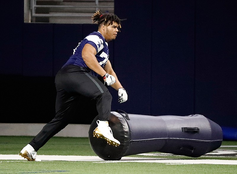 Dallas Cowboys rookie defensive tackle Trysten Hill runs through a drill during the NFL football team's minicamp in Frisco, Texas, Friday, May 10, 2019. (AP Photo/Tony Gutierrez)