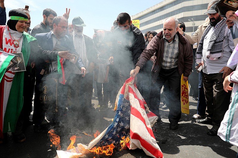 Iranian worshippers burn a representation of a U.S. flag during a rally after Friday prayer in Tehran, Iran, Friday, May 10, 2019. A top commander in Iran's powerful Revolutionary Guard said Friday that Tehran will not talk with the United States, an Iranian news agency reported — a day after President Donald Trump said he'd like Iranian leaders to "call me." (AP Photo/Ebrahim Noroozi)