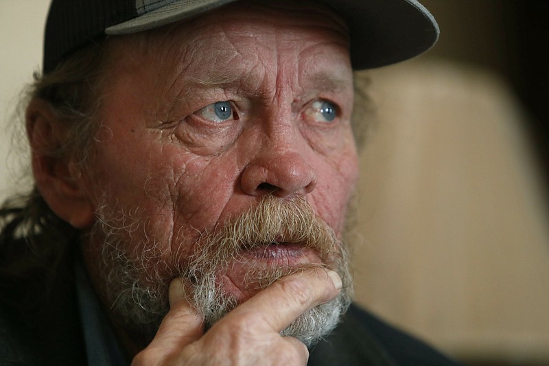In this Friday, March 22, 2019 photo, Allan Votaw, 66, pauses as he recalls and describes the years of abuse he suffered at the Cal Farley's Boys Ranch during an interview at this home in Kingston, Okla. Votow says his childhood years of 1957-1967 at the famed ranch near Amarillo, Texas were marked with horrible abuses against himself, his two brothers and numerous other boys placed under care of the rural institution. (AP Photo/LM Otero)