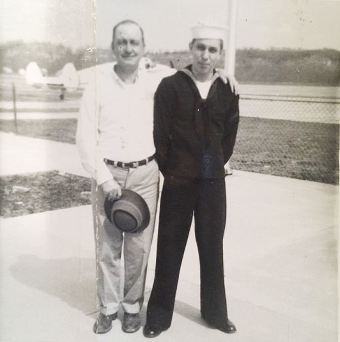 George Ousley is dressed in his Navy uniform with his father, George H. Ousley Sr., in March 1966.