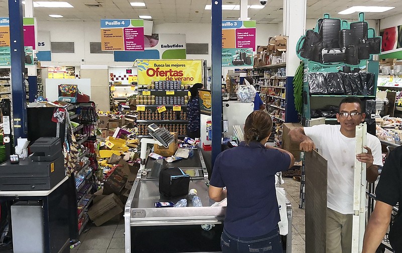 Some supermarket goods lie in the isles after an earthquake in Puerto Armuelles, Panama, Sunday, May 12, 2019. Authorities had no reports of serious damage or injuries more than two hours after the 6.1 magnitude earthquake struck a lightly populated area of Panama near its border with Costa Rica. (AP Photo)