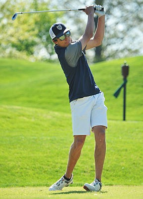 Ethan Johnson of Helias watches his tee shot during the Capital City Invitational earlier this year at Meadow Lake Acres Country Club. Johnson and the Crusaders start play today in the Class 3 state championships in Columbia.
