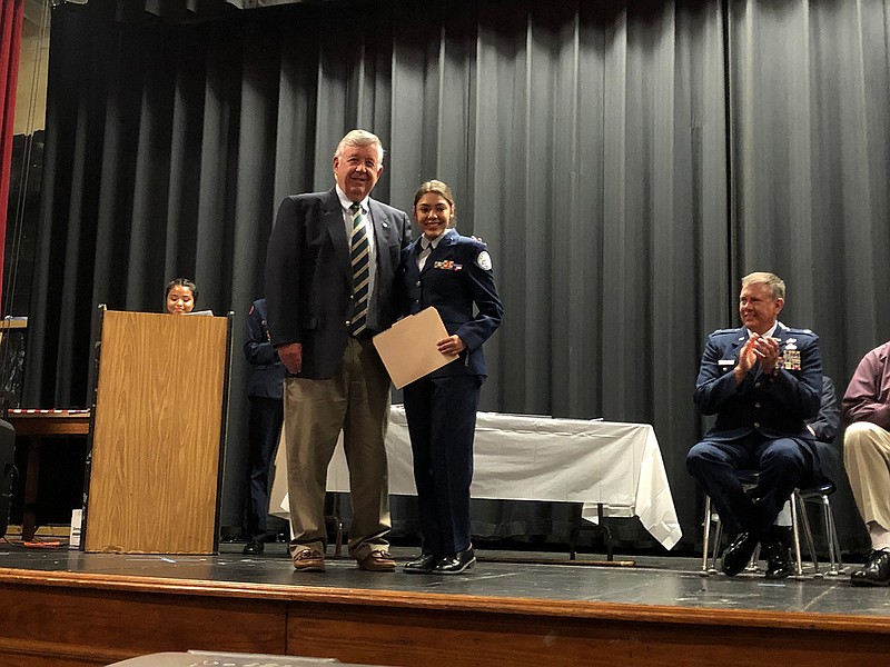 Hope High School student Briana Rodriguez, right, was named Air Force Association Cadet of the Year in Arkansas. Presenting the award was retired U.S. Air Force Col. David Mason.