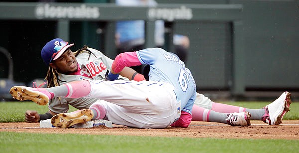 Billy Hamilton of the Royals beats the tag by Phillies third baseman Maikel Franco during the third inning of Sunday afternoon's game at Kauffman Stadium.