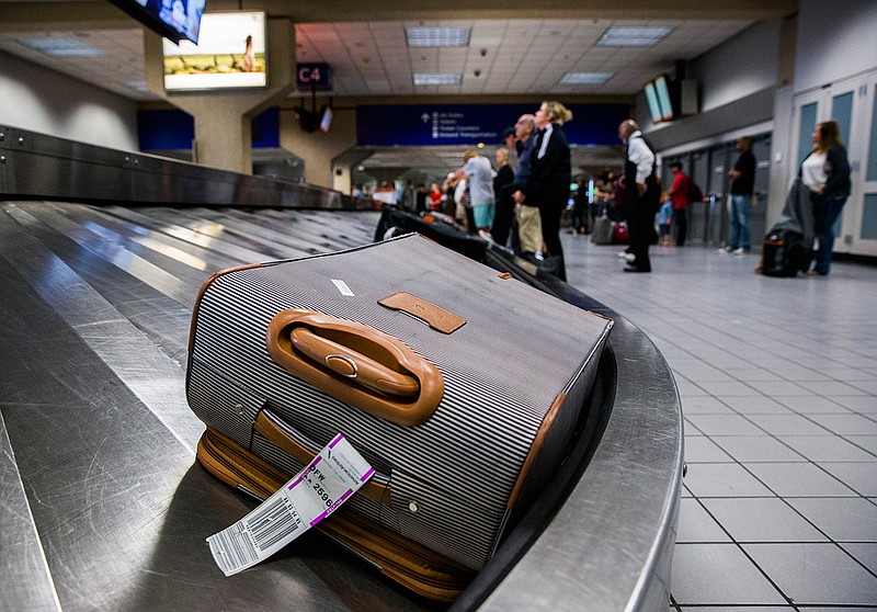  Luggage circles a baggage claim at Gate C on March 10, 2017, at Dallas Fort Worth Inter-national Airport.
Ashley Landis/Dallas Morning News/TNS