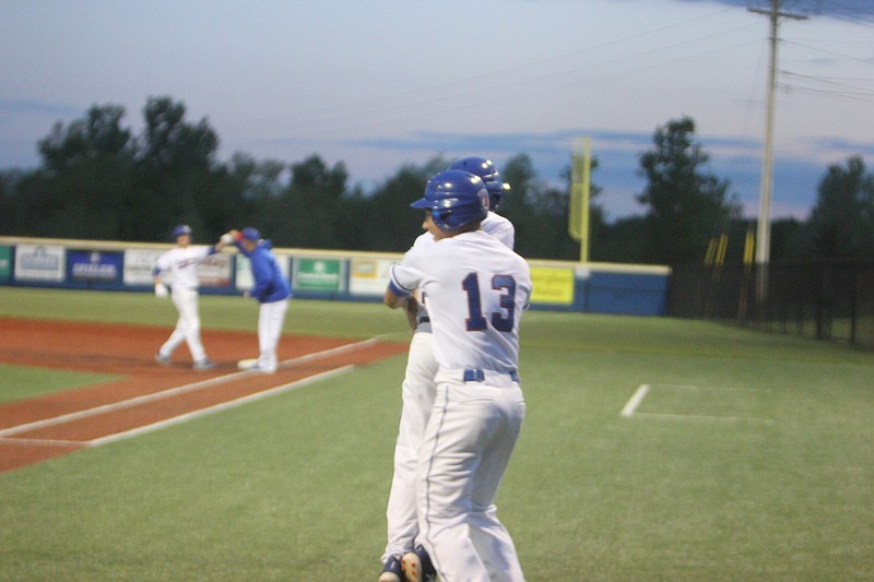 Drake Schlup and Clayton Winkler celebrate after California's 11-1 win over Versailles in the first round of districts on May 10, 2019.