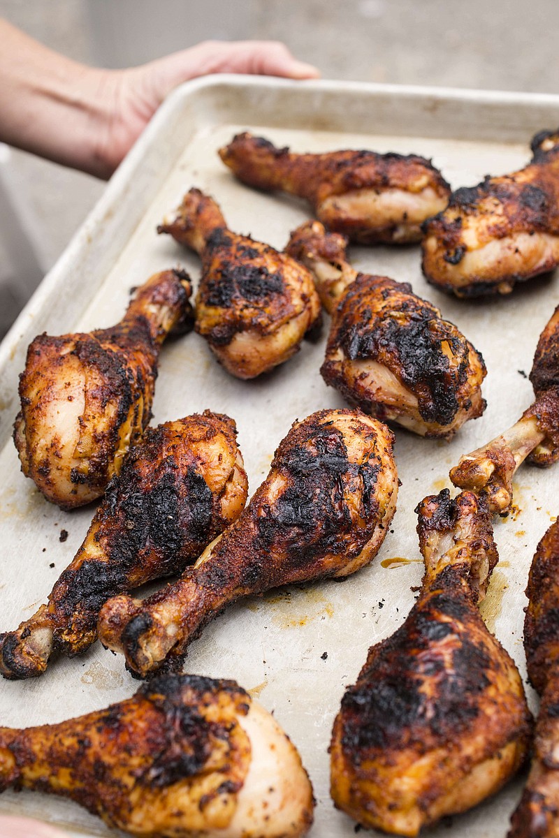 This photo provided by America's Test Kitchen shows Grill-Roasted Spice-Rubbed Chicken Drumsticks. (America's Test Kitchen via AP)
