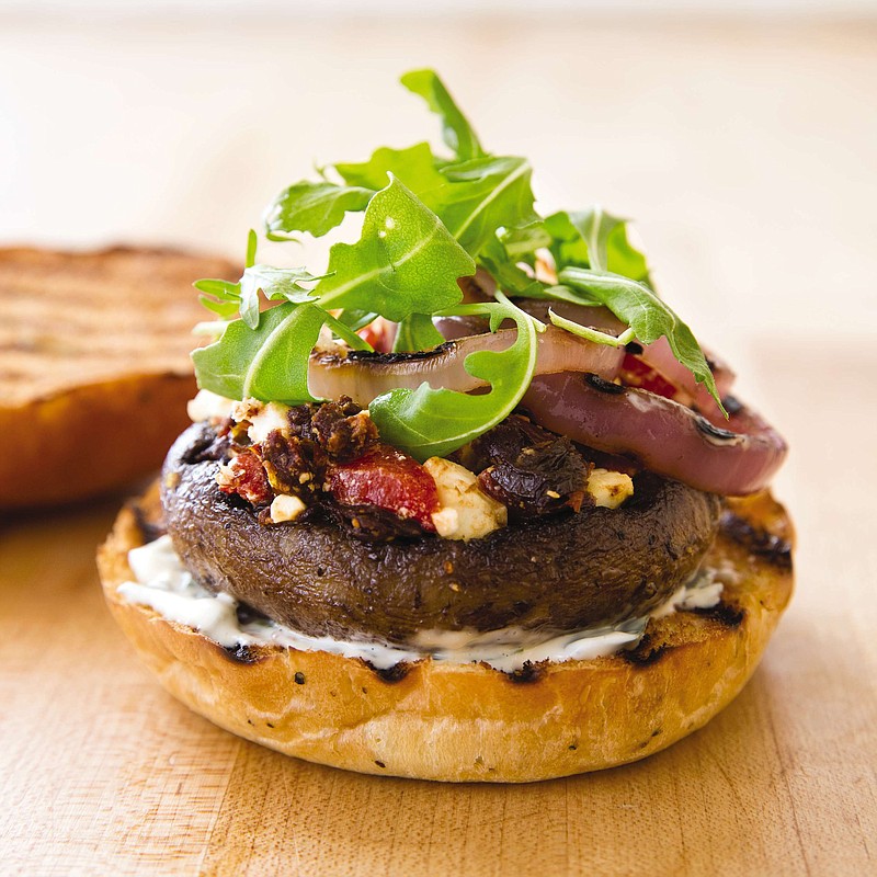 This undated photo provided by America's Test Kitchen in April 2019 shows a Grilled Portobello Burger in Brookline, Mass. This recipe appears in the cookbook "Vegetables Illustrated." (Joe Keller/America's Test Kitchen via AP)