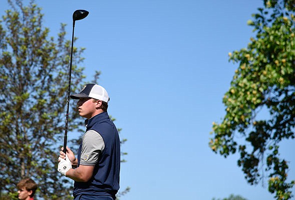 Lane Plunkett of Helias watches his tee shot during Monday's first round of the Class 3 state championships at Columbia Country Club.