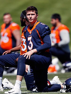 Broncos rookie quarterback Drew Lock takes part in drills during a training session Monday at the team's headquarters in Englewood, Colo.