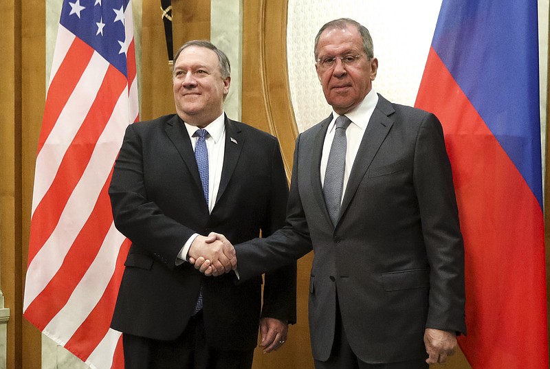 U.S. Secretary of State Mike Pompeo, left, and Russian Foreign Minister Sergey Lavrov pose for a photo prior to their talks in the Black Sea resort city of Sochi, southern Russia, Tuesday, May 14, 2019. Pompeo's first trip to Russia starts Tuesday in Sochi, where he and Russian Foreign Minister Sergey Lavrov are sitting down for talks and then having a joint meeting with President Vladimir Putin. (Russian Foreign Ministry Press Service via AP)