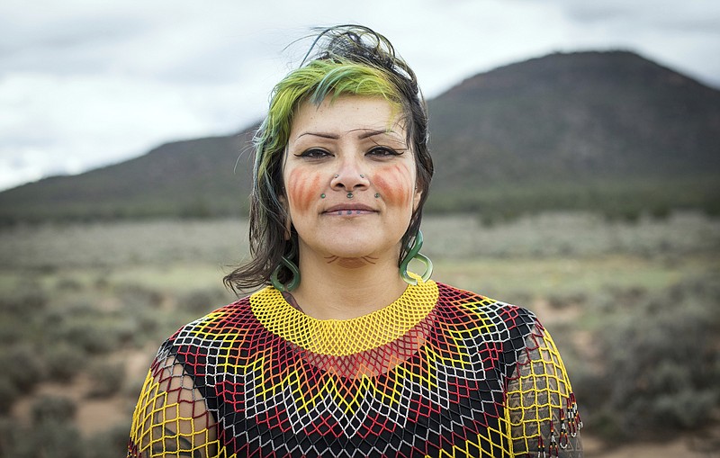 This undated photo provided by Amy Martin shows Ophelia Watahomigie-Corliss, a member of the Havasupai Tribal Council, at Red Butte, a site that the Havasupai consider sacred about 15 miles south of Tusayan, Ariz. Native American tribes are pushing the federal government to give them priority when it issues licenses that could expand internet coverage in their communities. Tribes in Oklahoma, Wisconsin, Washington, Idaho and others in Arizona also are pressing the FCC for a priority filing window. On the Havasupai Tribal Council, Watahomigie-Corliss is dubbed the telecommunications member. (Amy Martin via AP)