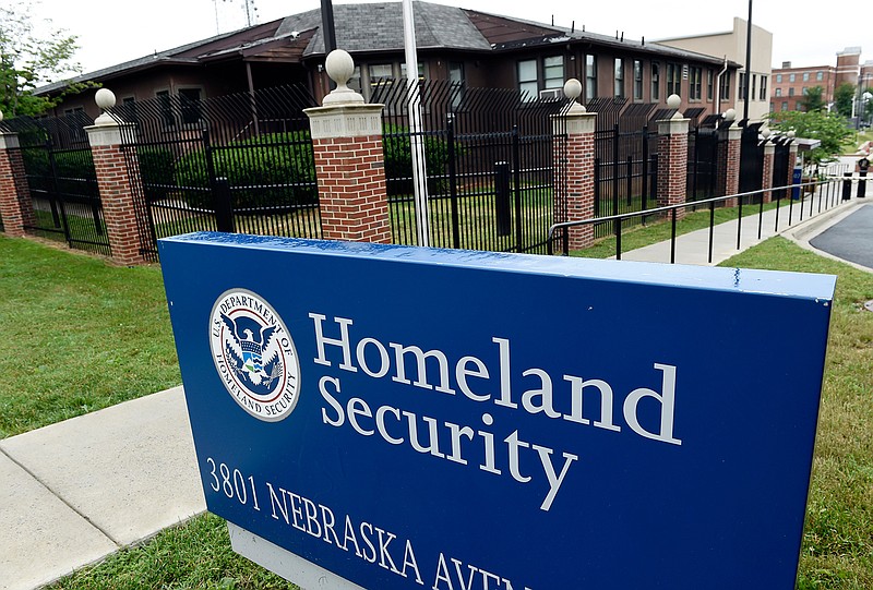 This June 5, 2015, file photo, shows the Homeland Security Department headquarters in northwest Washington. Homeland Security officials considered arresting migrant families around the country who had final deportation orders and removing them from the U.S. in a flashy show of force, according to two Homeland Security officials and two people familiar with the proposal. (AP Photo/Susan Walsh, File)