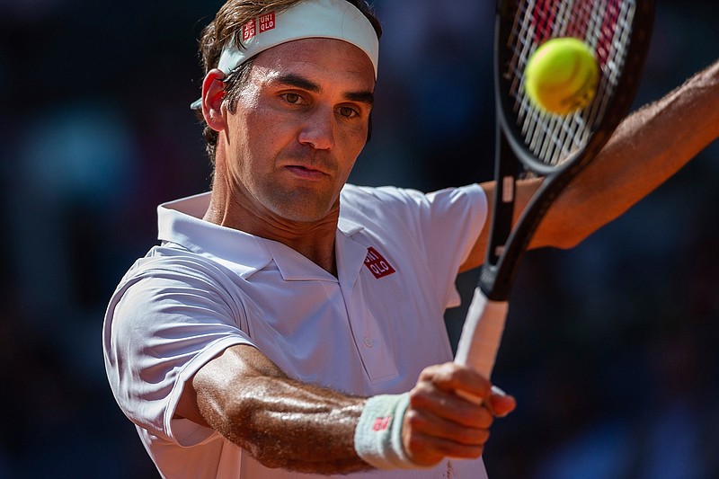 Roger Federer, from Switzerland, returns the ball to Gael Monfils, from France, during the Madrid Open tennis tournament in Madrid, Spain, Thursday, May 9, 2019. (AP Photo/Bernat Armangue)