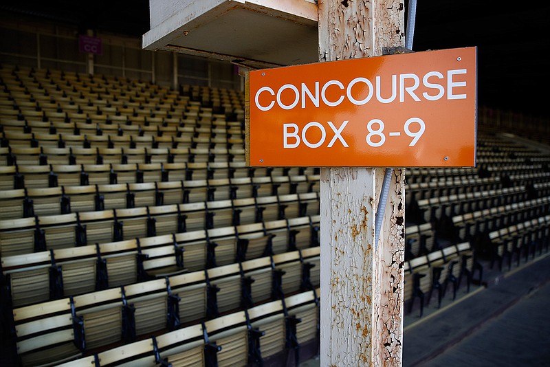 In this May 15, 2018, file photo, paint peels from a support beam in a grandstand seating area at Pimlico Race Course as preparations take place for the Preakness Stakes horse race in Baltimore. The future of Pimlico has turned into a tug of war involving city officials, who want it to stay in Baltimore, and the owners of the track, who long to move the second jewel of the Triple Crown to nearby Laurel. (AP Photo/Patrick Semansky, File)