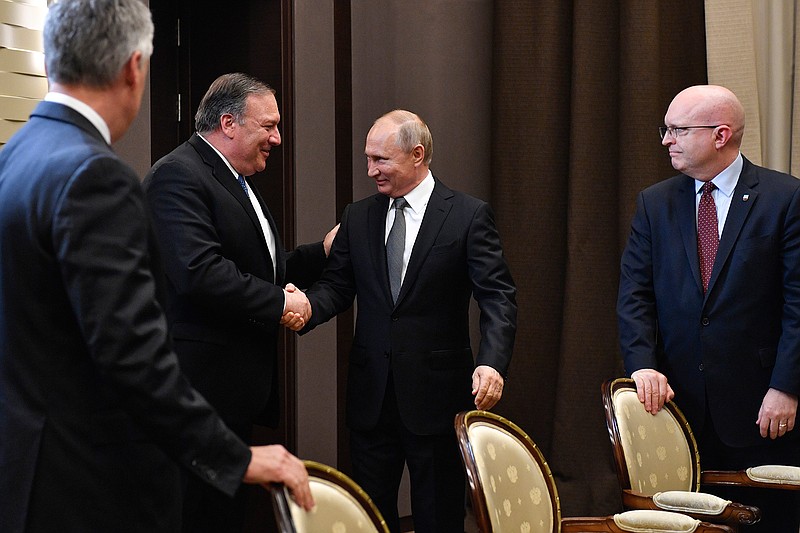 Russian President Vladimir Putin, second right, and U.S. Secretary of State Mike Pompeo, second left, greet each other prior to their talks in the Black Sea resort city of Sochi, southern Russia, Tuesday, May 14, 2019. Pompeo arrived in Russia for talks that are expected to focus on an array of issues including arms control and Iran. (Alexander Nemenov/Pool Photo via AP)