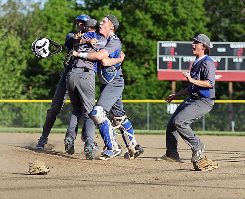 Russellville teammates Dawson Koch, Nick Thompson, Trenton Morrow and Nikolas Graham celebrate after the Indians defeated the Eugene Eagles 3-2 to win Tuesday's Class 2 District 9 championship game in Eugene.