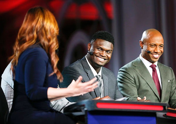 Duke's Zion Williamson (second from right) is interviewed by an ESPN reporter during the NBA draft lottery Tuesday in Chicago.