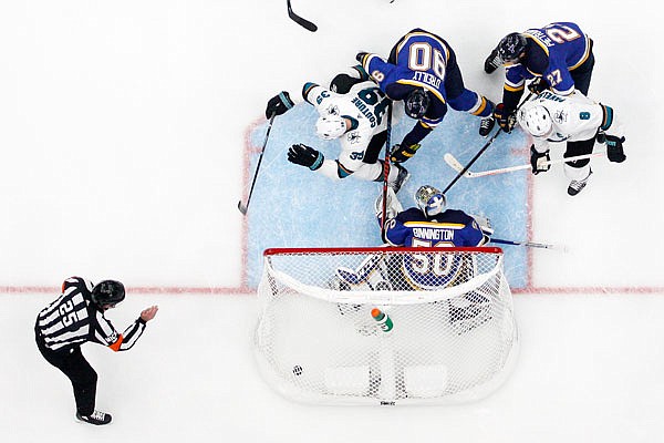 Sharks center Logan Couture (39) scores the tying goal against Blues goaltender Jordan Binnington (50) during the third period Wednesday in Game 3 of the NHL Stanley Cup Western Conference final in St. Louis.