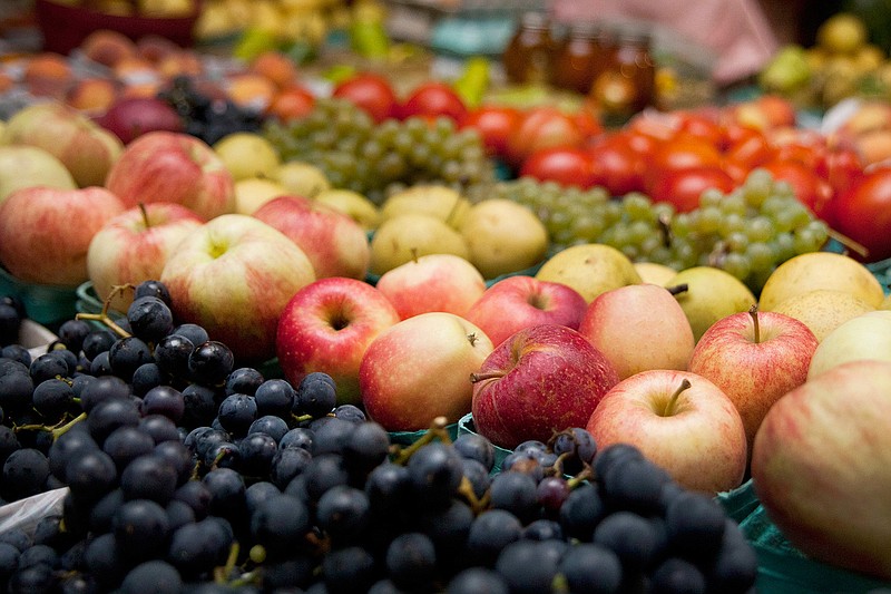 In this Sept. 18, 2014 file photo, produce is displayed for sale at a farmers market in Kalamazoo, Mich. A study released on Wednesday, May 15, 2019 suggests that trimming dietary fat and eating more fruits and vegetables may lower a woman's risk of dying of breast cancer. (Katie Alaimo/Kalamazoo Gazette via AP)