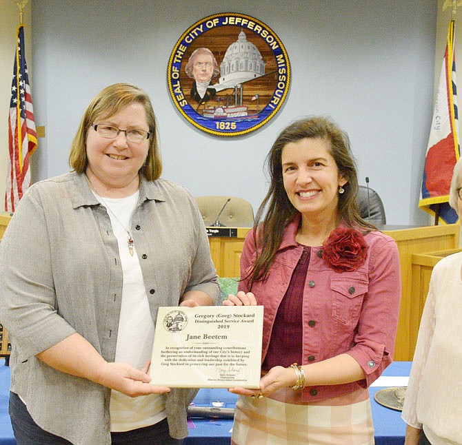 Mayor Carrie Tergin presents the Gregory Stockard Distinguished Service Award to Jane Beetem on Wednesday during the city's annual Heritage Month celebration at City Hall.